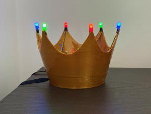 plastic crown with colorful LEDs